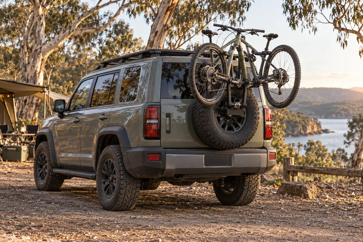 Generic AI concept of an unbranded 4WD carrying bicycles near its rear spare wheel; not a photograph of the listed TANK bike carrier or proof of fitment